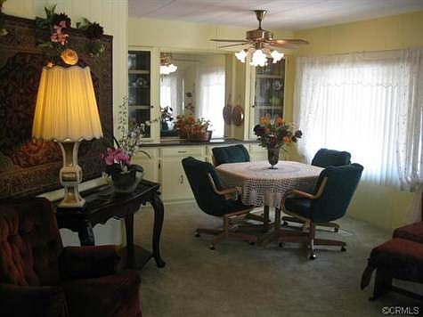 Formal dining area w built in hutch adjacent to living room.