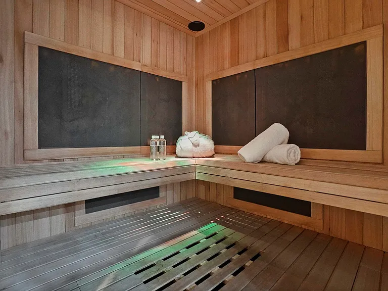 Step into the warmth of CURE Spa's private sauna_an elevated wellness experience nearby.