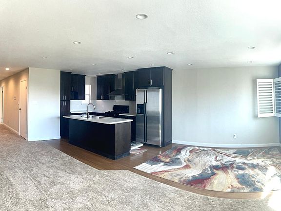 Hall, kitchen and dining area view (panoramic photo)
