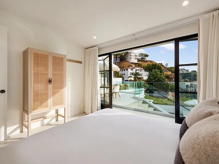 Wake up to panoramic hillside views in total comfort.