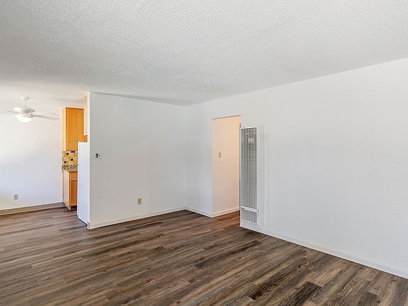 Comfortable living space with defined dining area and ample natural light.