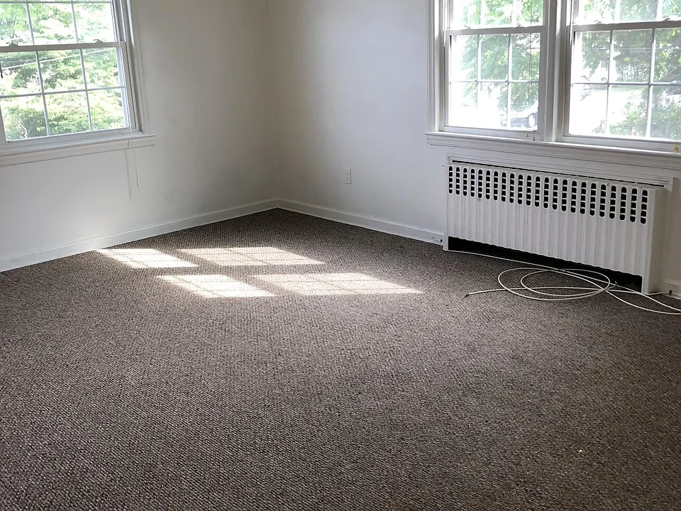 Bright, airy living room with views of Ash Creek. Access to