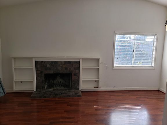 Fireplace with built in bookshelves