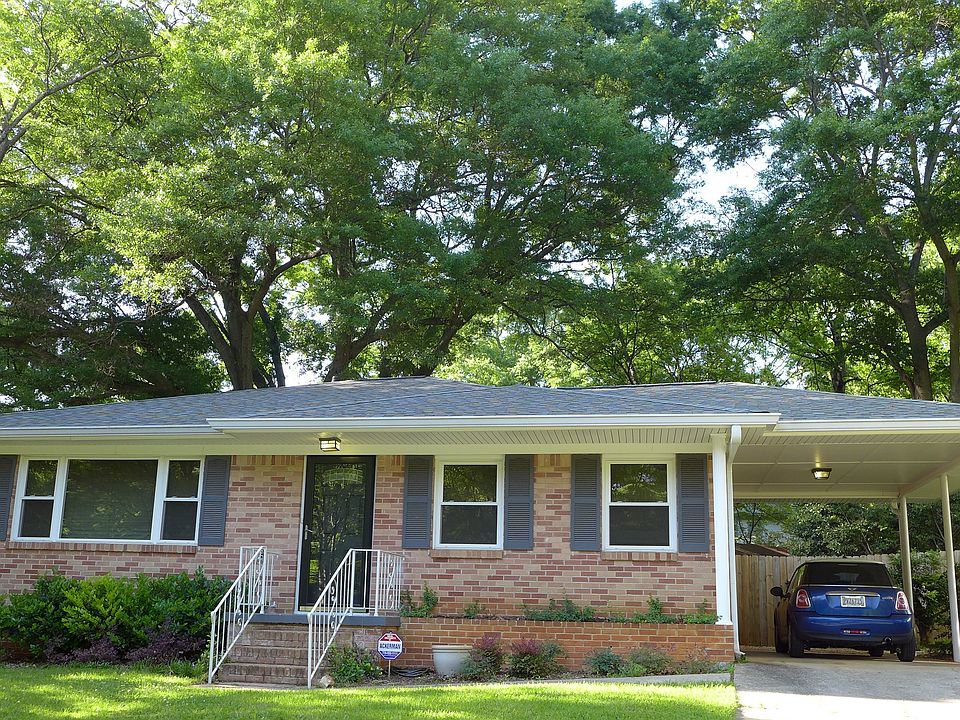Street view. Carport and driveway parking.