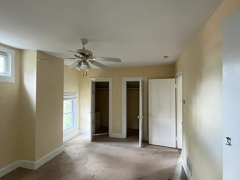 Other view of bedroom. Walk in closet and view of entrance to living room.