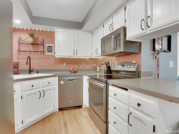 Updated kitchen, stainless appliances, hardwood floors, tons of cabinet space, newer fixtures.