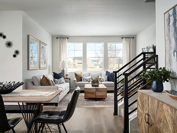 Example of Bright and Open Dining and Great Room with Laminate Wood Flooring