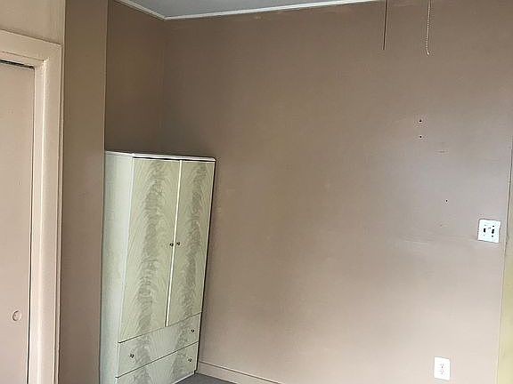 Bedroom with armoire. 