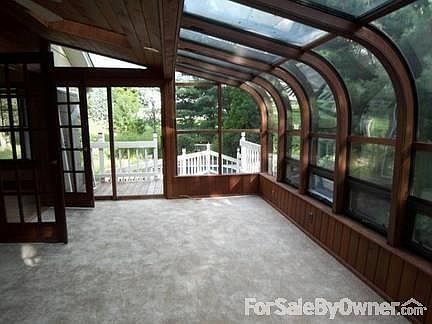Sunroom
						:
						From the sunroom, step outside onto the layered deck overlooking the pool.