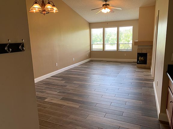 Large living/dining space with working fire place