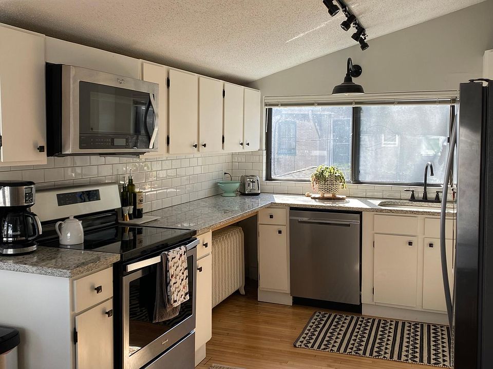 Stainless steel appliances in recently redecorated kitchen