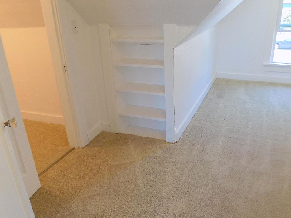 charming built in shelves in bedroom 2 and walk in closet