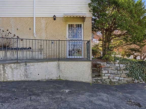 Alternate view of the front of the property with private entrance and parking.