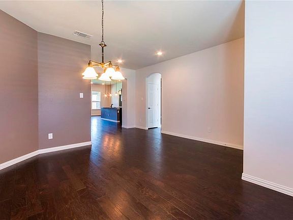 Hardwoods continue throughout the Foyer, Formal Dining and on into Family Room