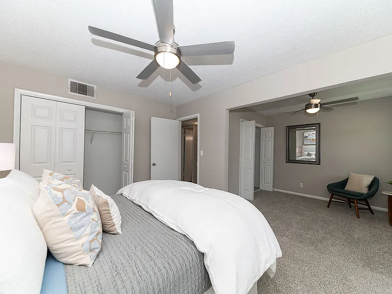 Cozy bedroom with carpet & ceiling fan