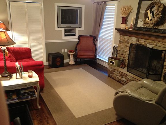 Den w/ fireplace and laundry room entrance