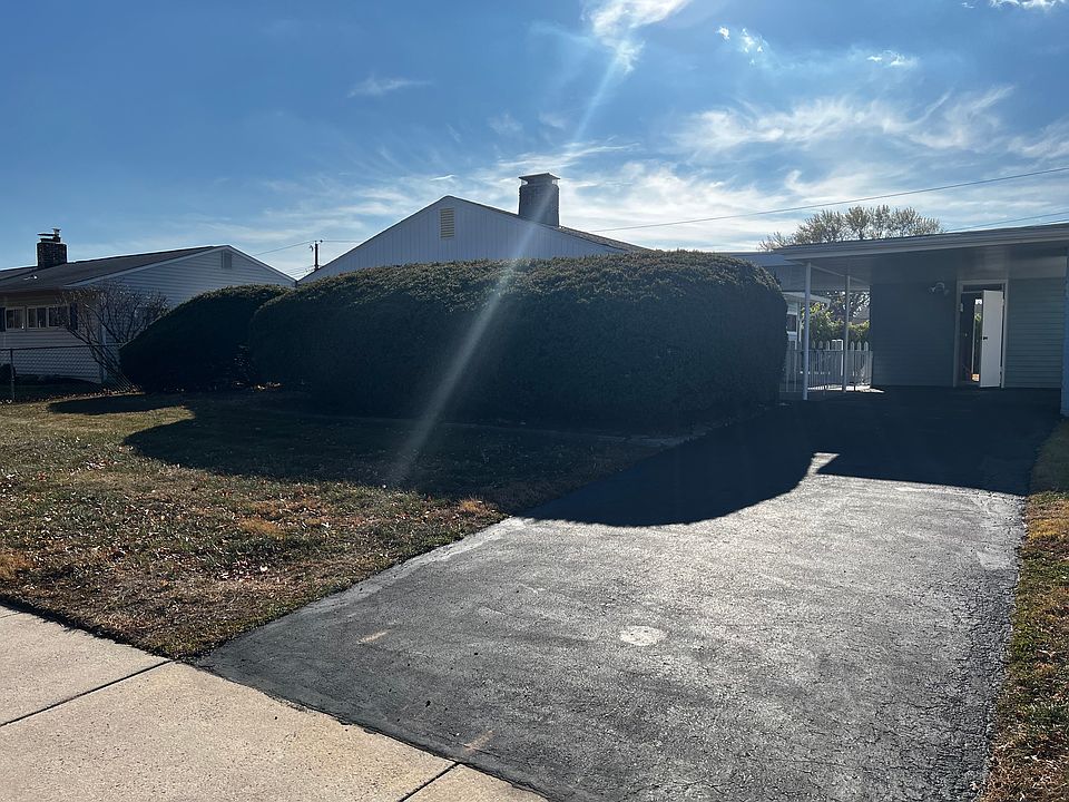 Front View Driveway, Car port and garage.