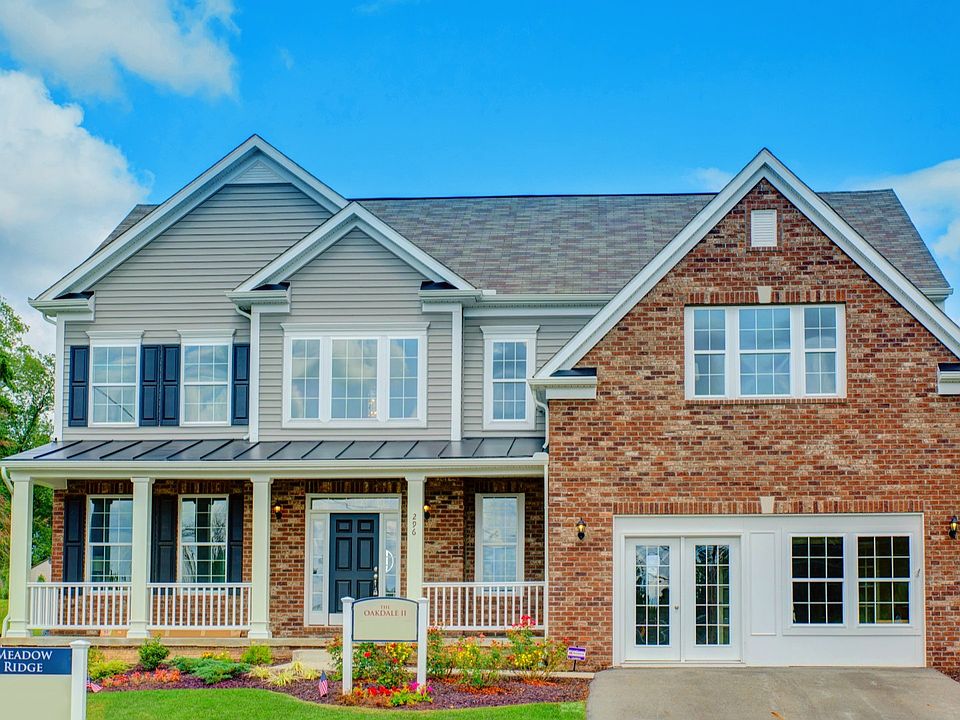 Exterior view of the Oakdale II, a stunning partial brick two-story home with a covered porch