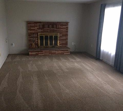 Den with fireplace