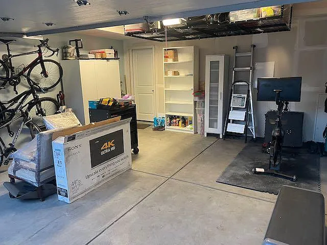 2- Car Garage with overhead storage rack. All personal property will be cleared out when you move-in. Except 2 shelving units for your personal storage use.