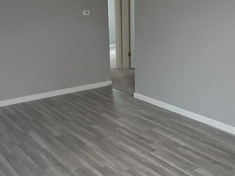 Living room facing bedrooms and hallway
