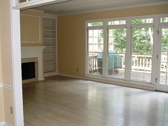 Light filled living room with tons of built in cabinets
