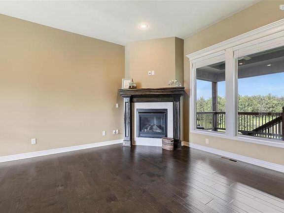 Corner fireplace and beautiful mantle make for a lovely focal point in the great room