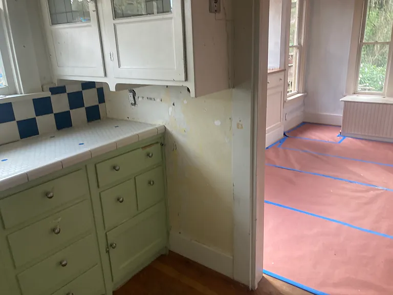 Kitchen with charming tile and cabinets. Much storage.