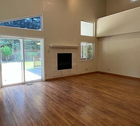 Living Room with sliding door to large deck in the backyard.