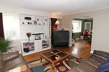 Living Room with Custom Built Ins and Hardwoods