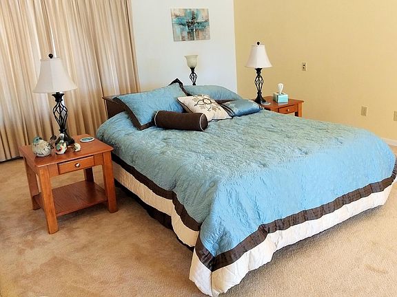 Master bedroom with door to lanai and pool.