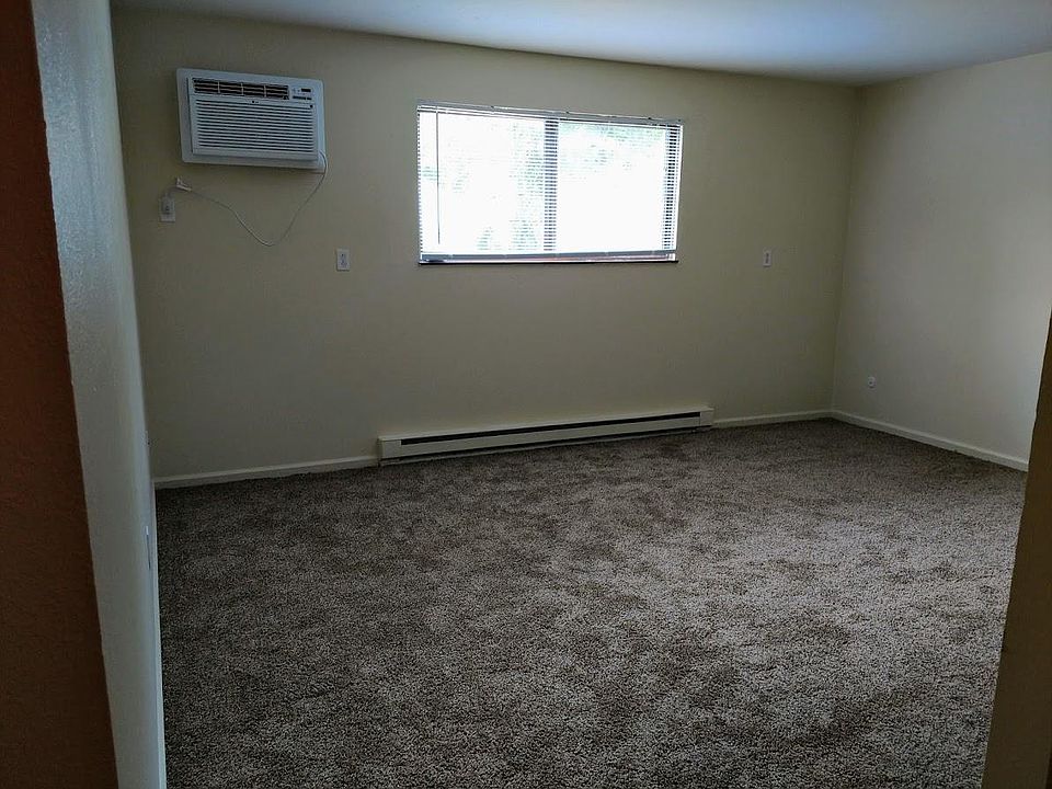 Large living room with new air conditioner and new carpet!
