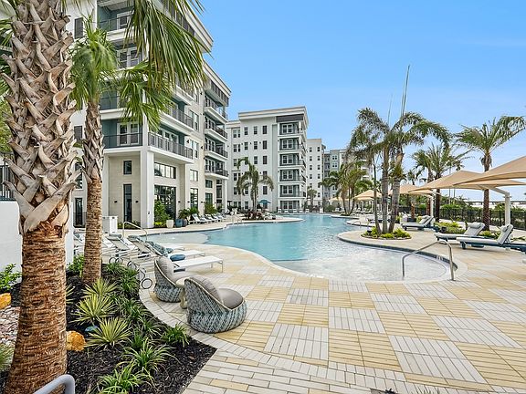 Resort-Style Pool with Sun Shelf and Grilling