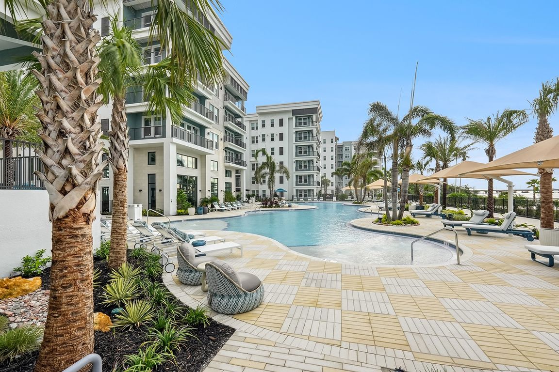 Resort-Style Pool with Sun Shelf and Grilling