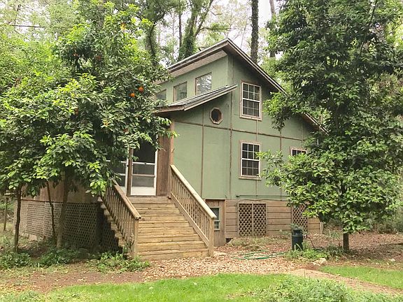 Eastern exposure of house on 1 wooded acre in an intentional