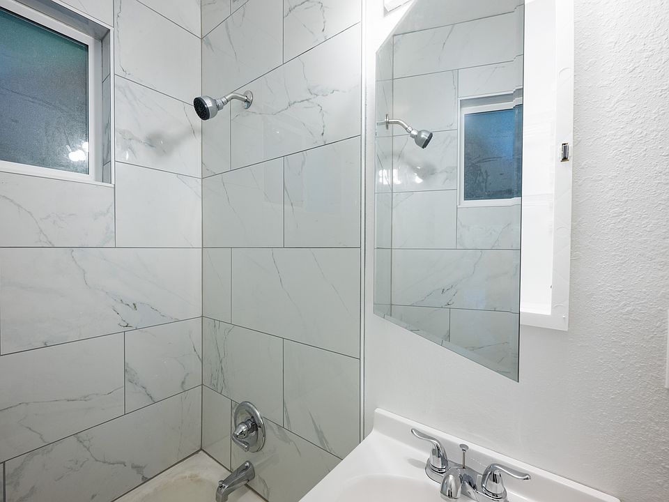 Beautifully remodeled bathroom, large stone tile shower and bathtub!