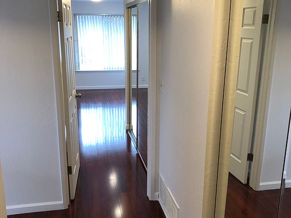 Entrance with large mirrored closet