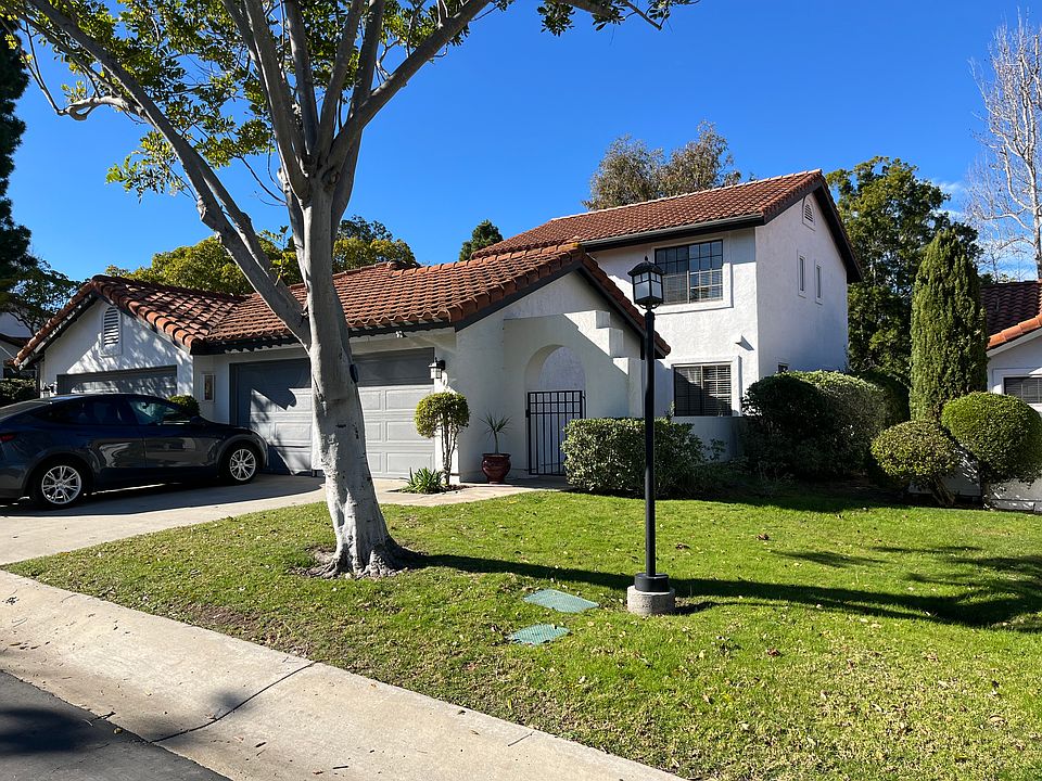 Front entrance of the 2-story unit with full driveway.