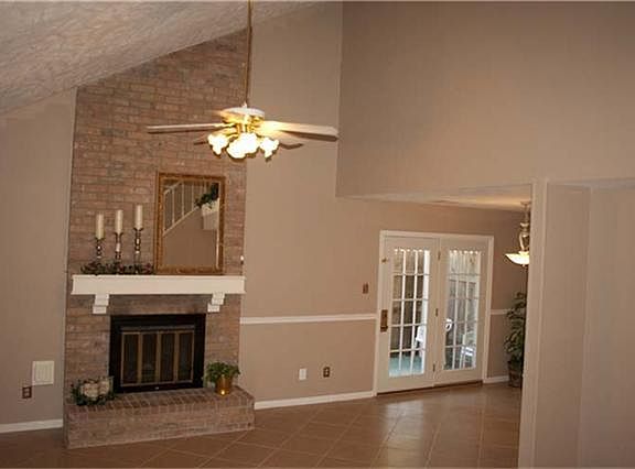 Living area, vaulted ceiling, fan, majestic gas log fireplace!