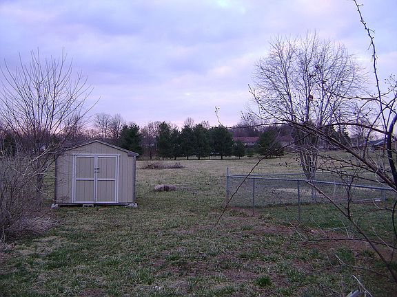 large back yard with storage