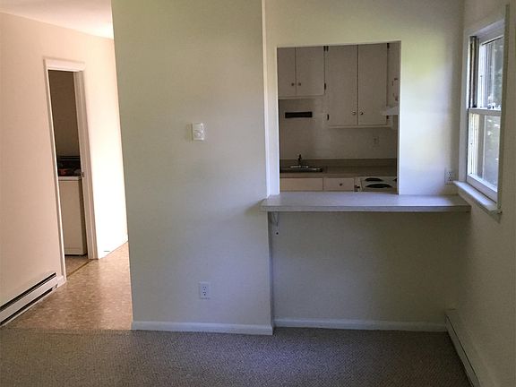 Spacious living area with pass through galley kitchen. Carpet looks brand new.