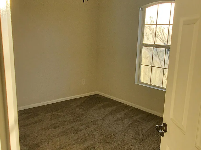 Bedroom #2 - Featuring Wall to Wall carpeting, ceiling fan and double door closet.
