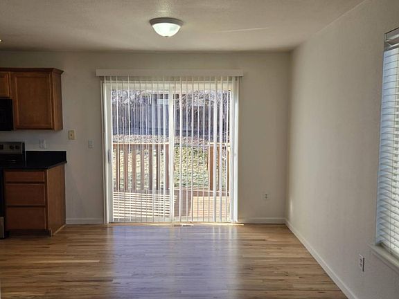 A slider to the fenced back yard. A small deck. Sprinkler system