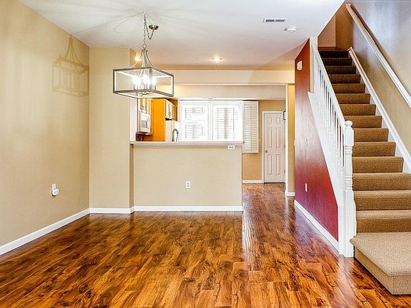Dining area looking towards the kitchen; stairwell going up to the bedroom level.