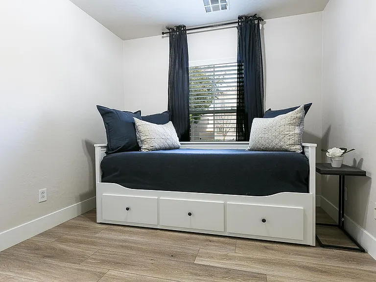 A trundle bed that opens up to 2 side by side twins/king