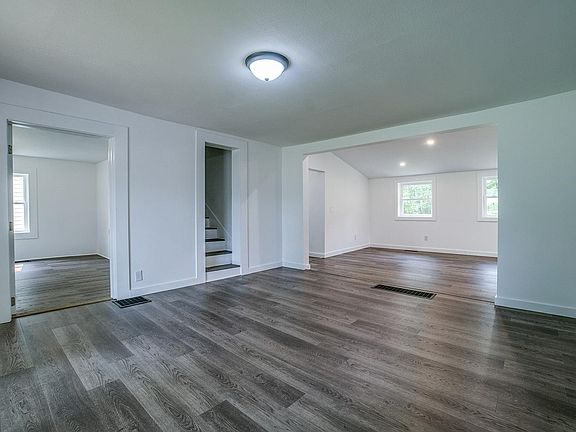 Living room with view of open dining room
