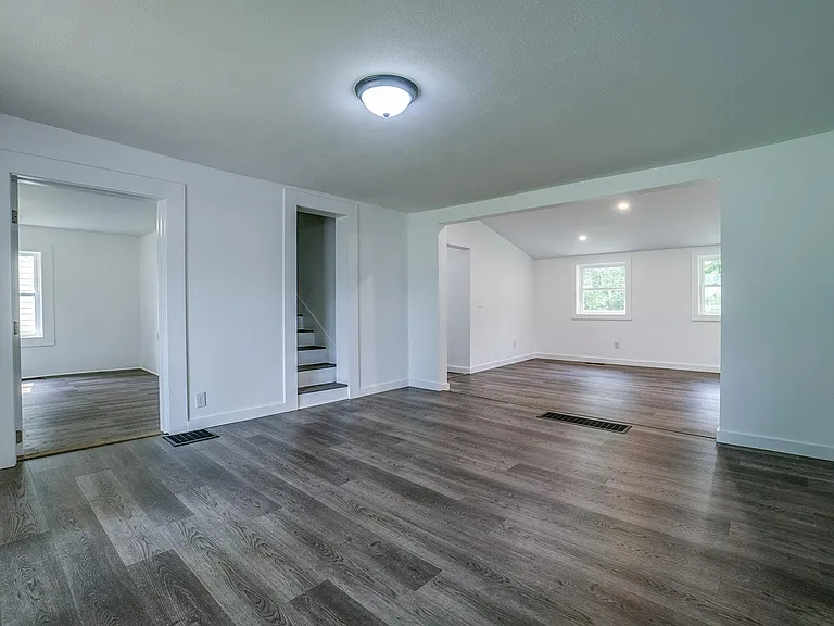 Living room with view of open dining room