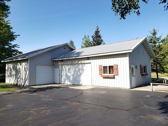 Garage has 3 stalls-a workshop-and a guest room