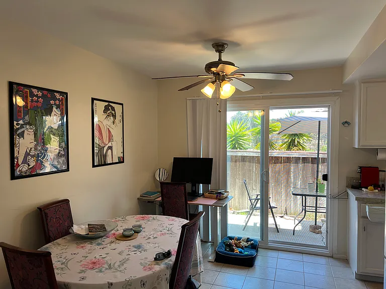 Looking from living area through dining area out toward patio