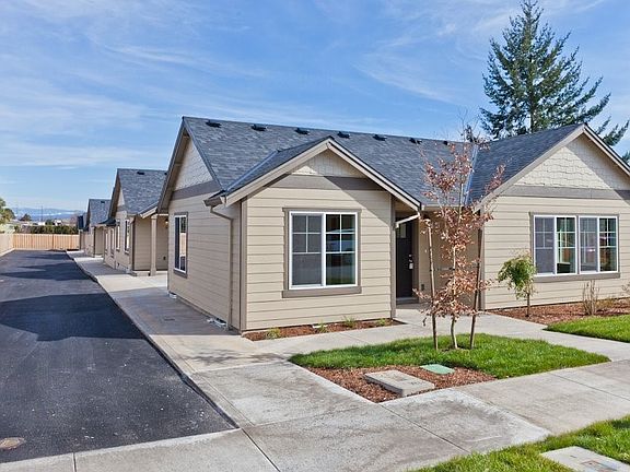 Garage is attached at the side with entry into the living room.